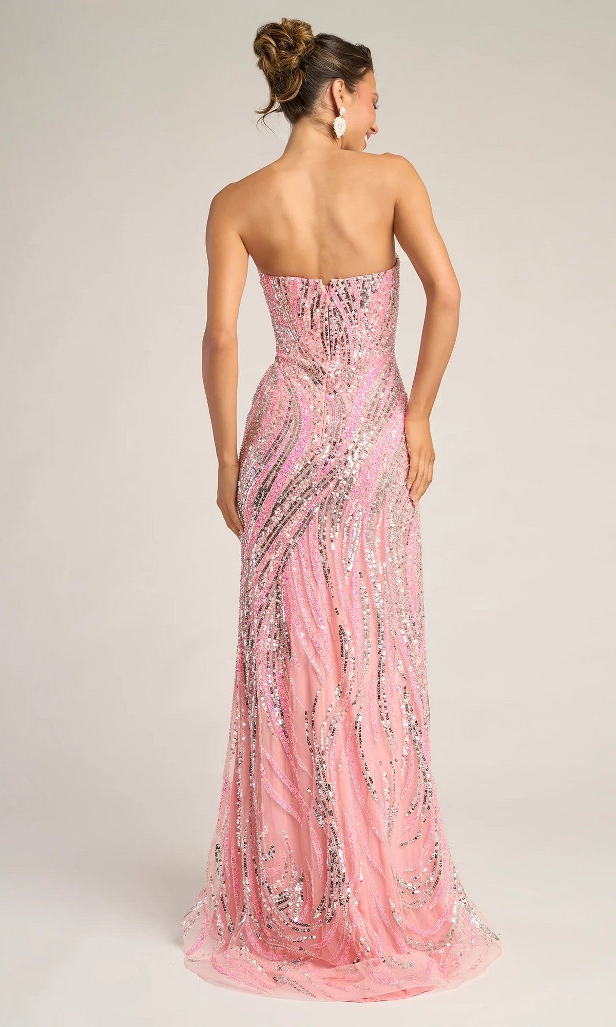 A woman is shown from the back against a plain background, wearing the Portia and Scarlett PS26419C long formal dress—strapless, floor-length, pink with silver sequin patterns.